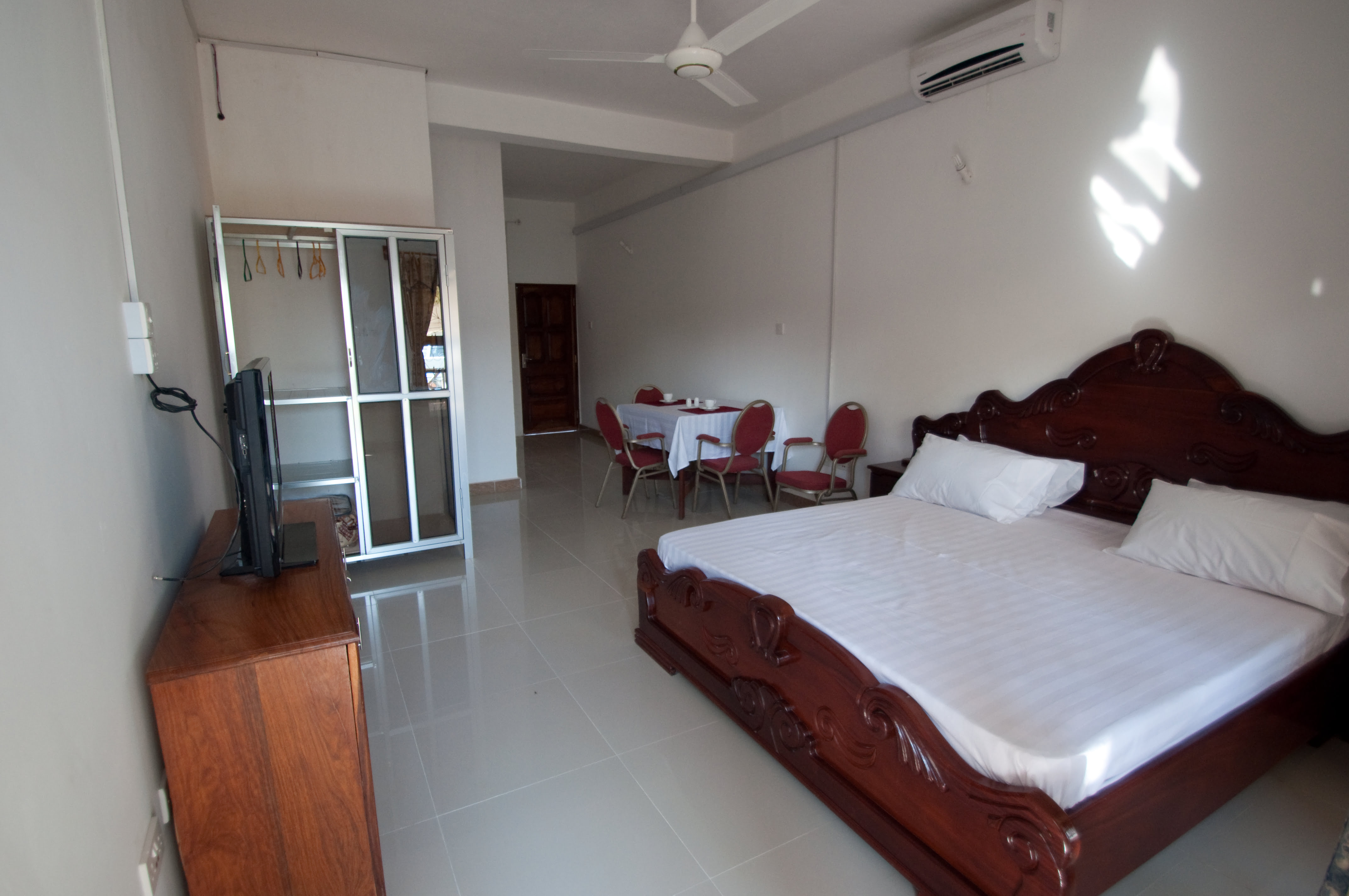 Unwind in style in our handcrafted wooden bed, perfect for a restful night's sleep.