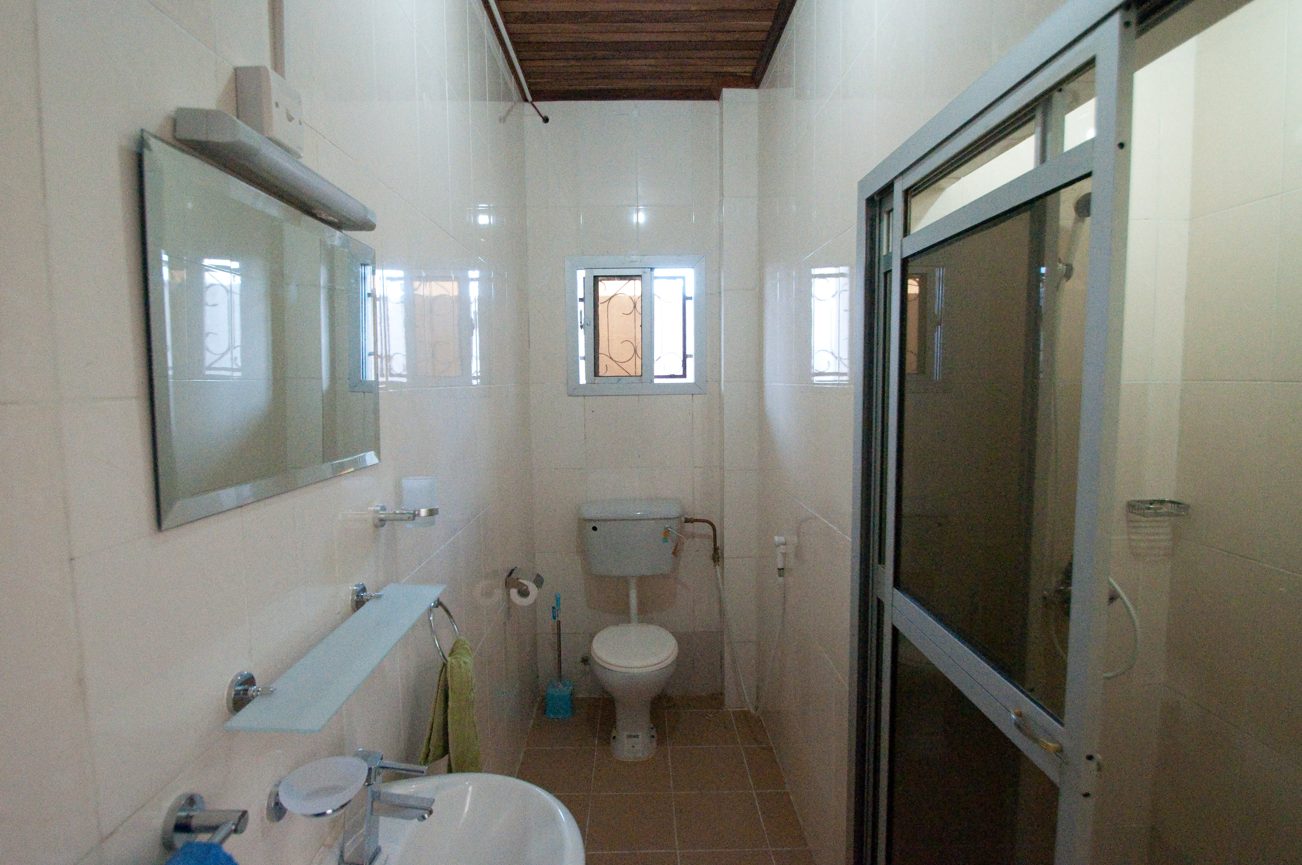 Enjoy the luxury of a private ensuite bathroom in our studio holiday apartment. This photo showcases the stylish and functional space.